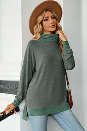 Colorblock raglan turtleneck tunic in heather gray with green accents, featuring a relaxed fit and side slits.