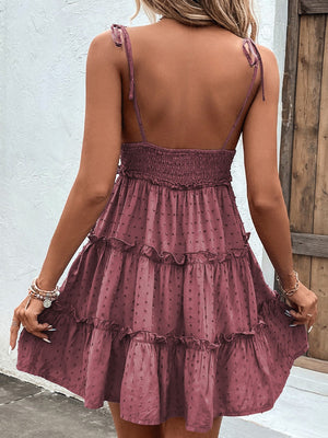 Dotted Swiss tiered dress in dusty pink with tie straps and smocked bodice.