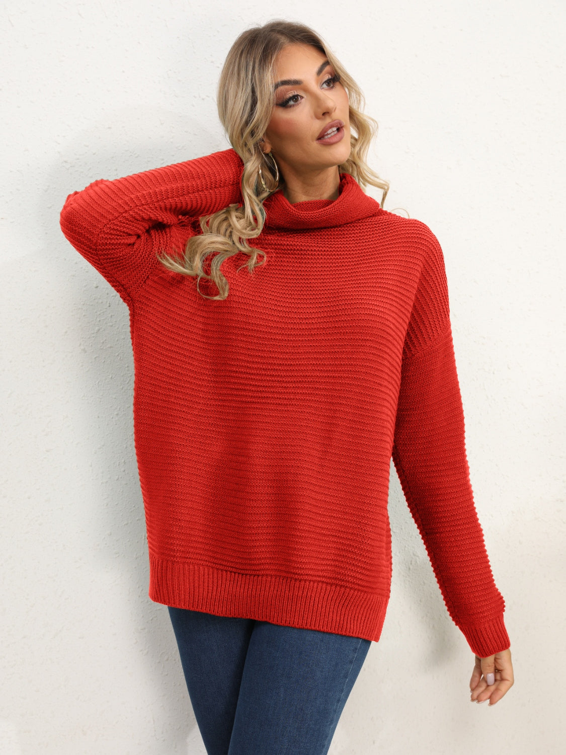 Textured knit oversized turtleneck pullover in Deep Red with ribbed details.
