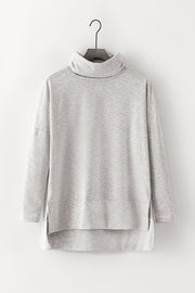 Light gray tunic with cowl neckline and high-low hem.