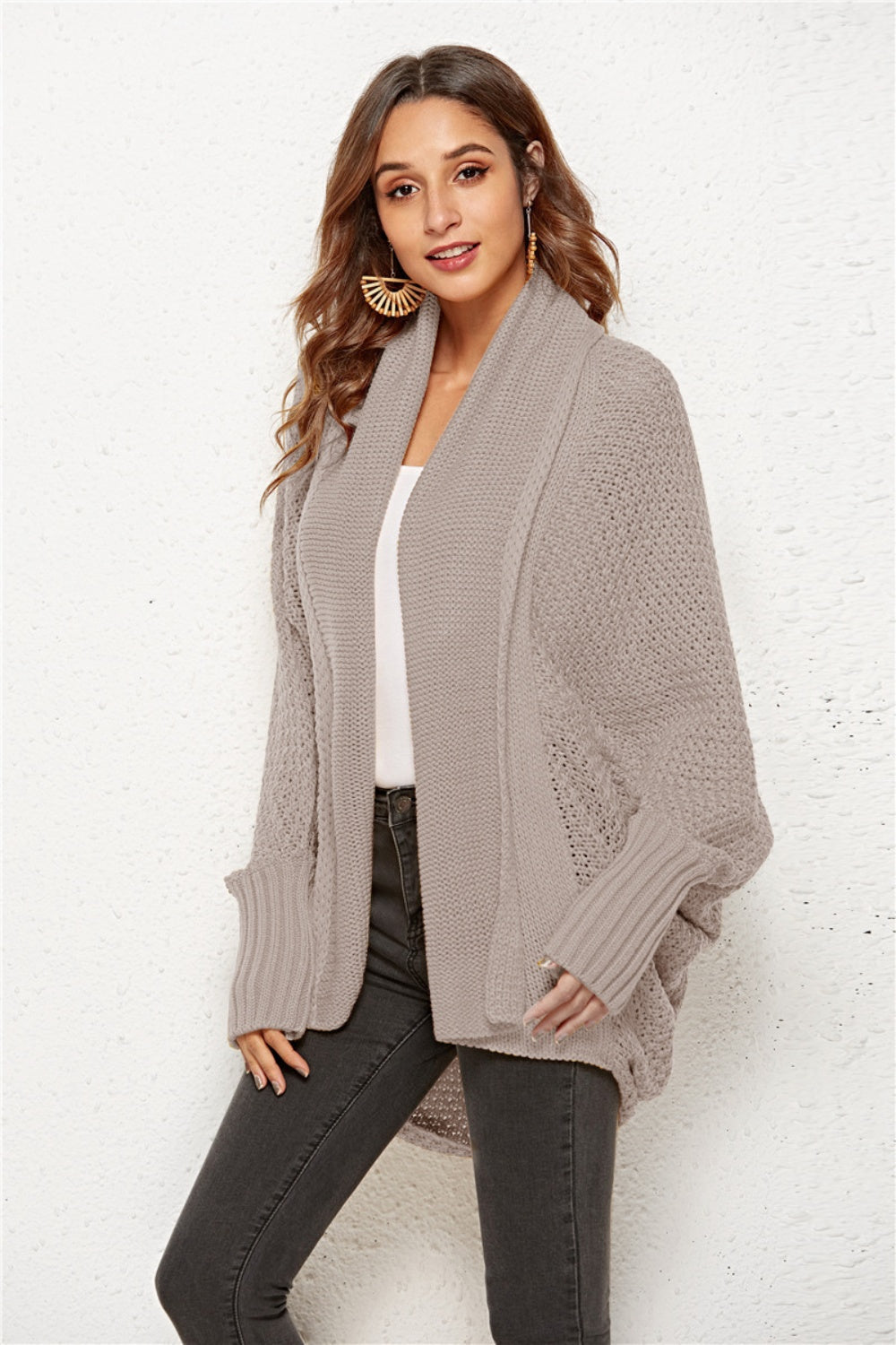 Textured cocoon knit cardigan in tan with batwing sleeves and open front.