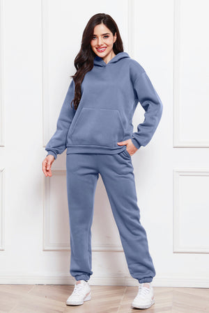 Light blue relaxed hoodie and joggers set with front pocket and drawstring waist.