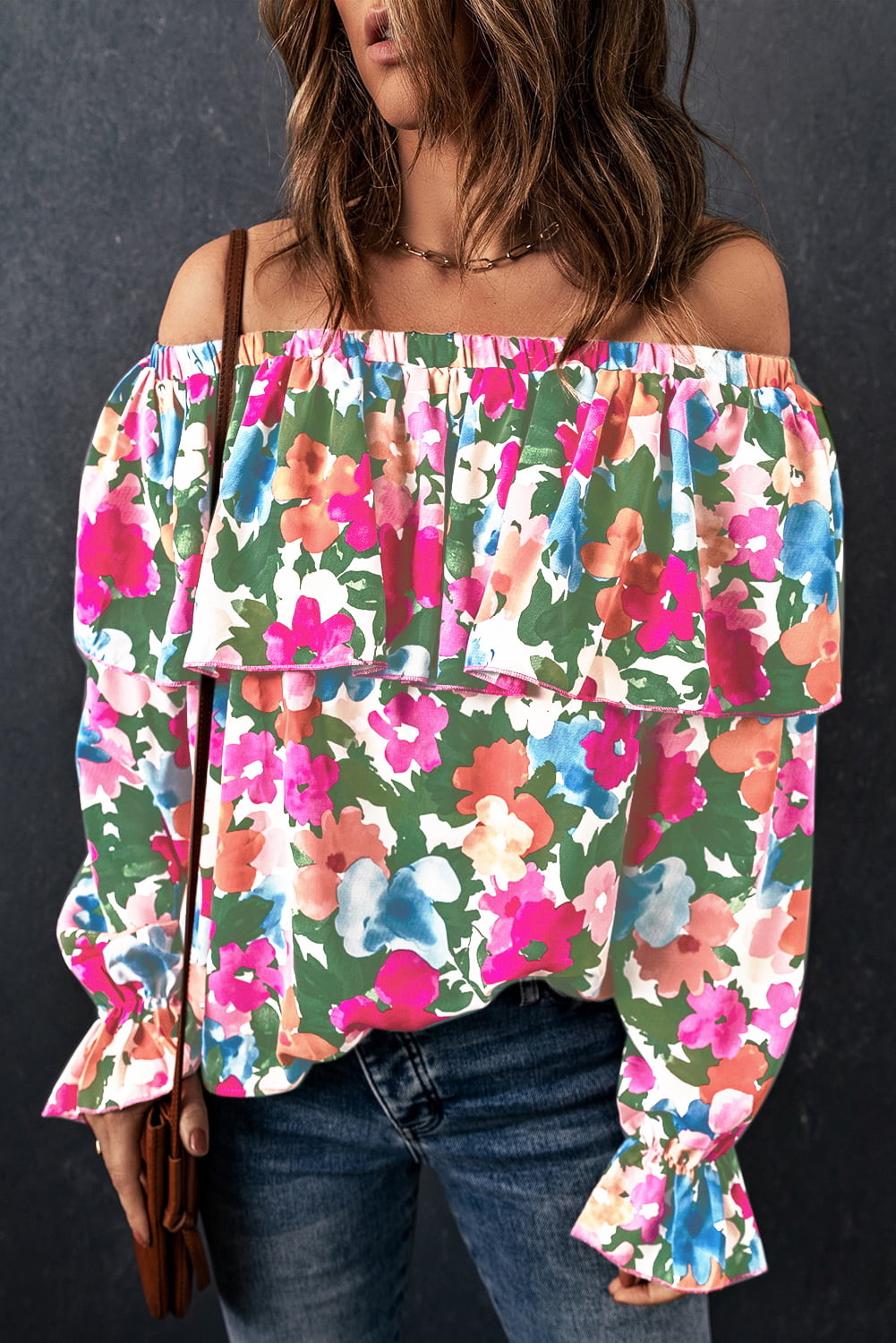 Floral ruffle off-shoulder poet blouse with long sleeves and a tiered bodice.