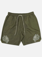 Army green performance shorts with embroidered wolf heads and white drawstring.