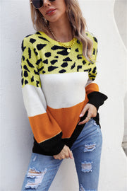 Leopard Patchwork Balloon Sleeve Knit sweater in yellow, white, orange, and black acrylic with balloon sleeves.