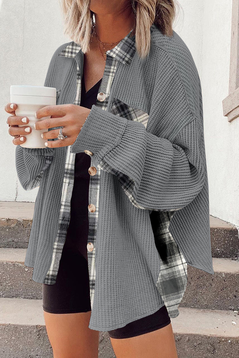 Light gray waffle knit overshirt with plaid trim and button front, styled casually.