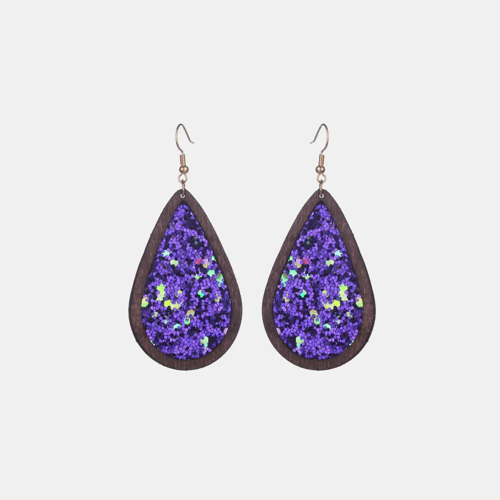 Wood-framed teardrop earrings with purple glitter inlay and hook backs