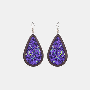 Wood-framed teardrop earrings with purple glitter inlay and hook backs