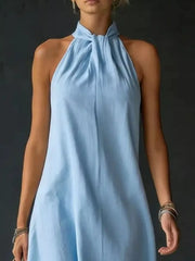 Light blue cotton blend maxi dress with twisted halter neckline and a-line cut.