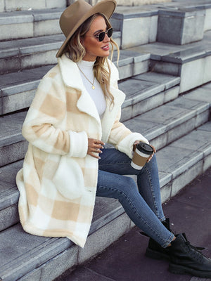Beige checkered teddy cocoon coat with button front and pockets.