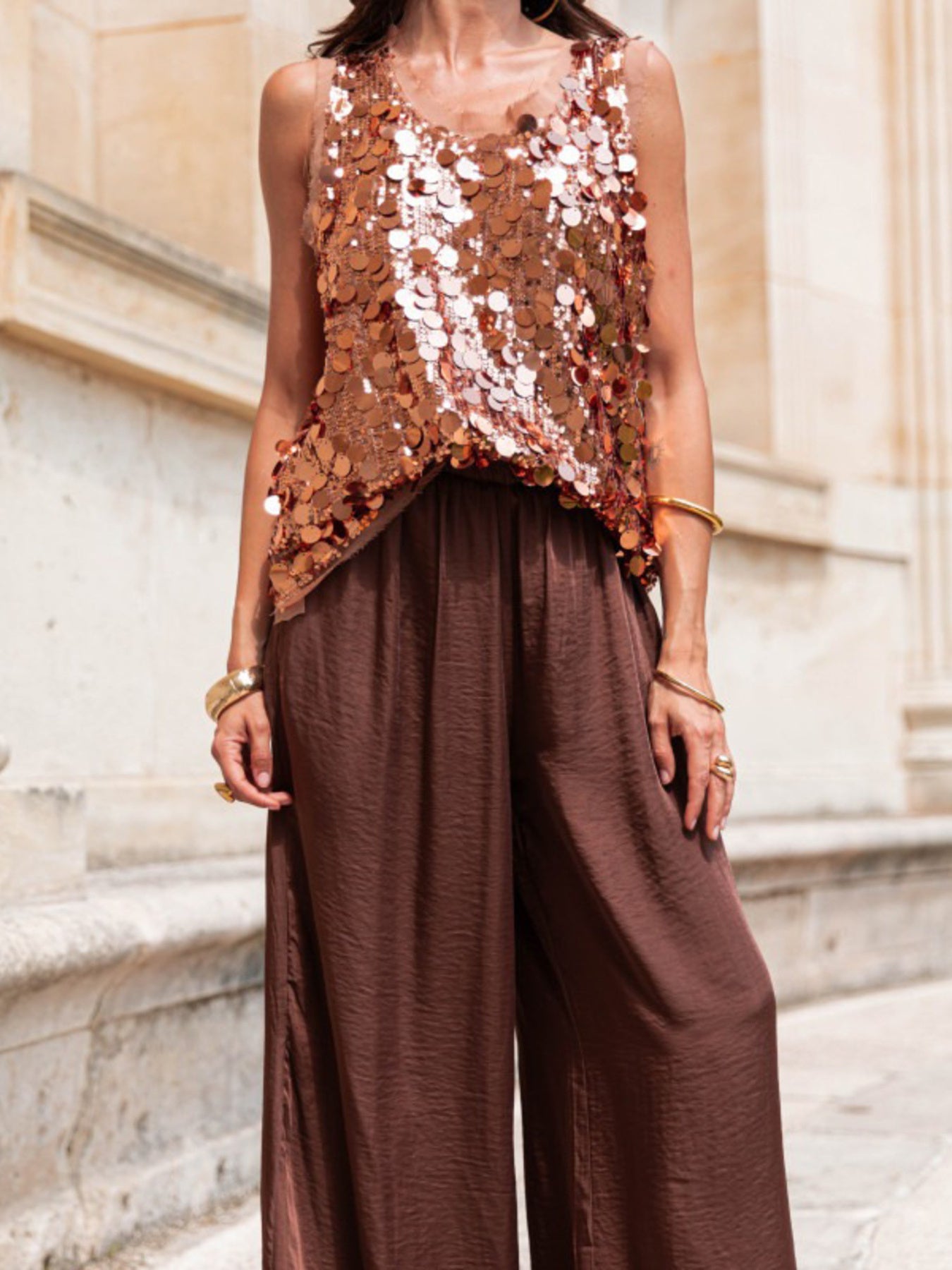 Sequin embellished tank top in a rose gold hue with a scoop neckline.