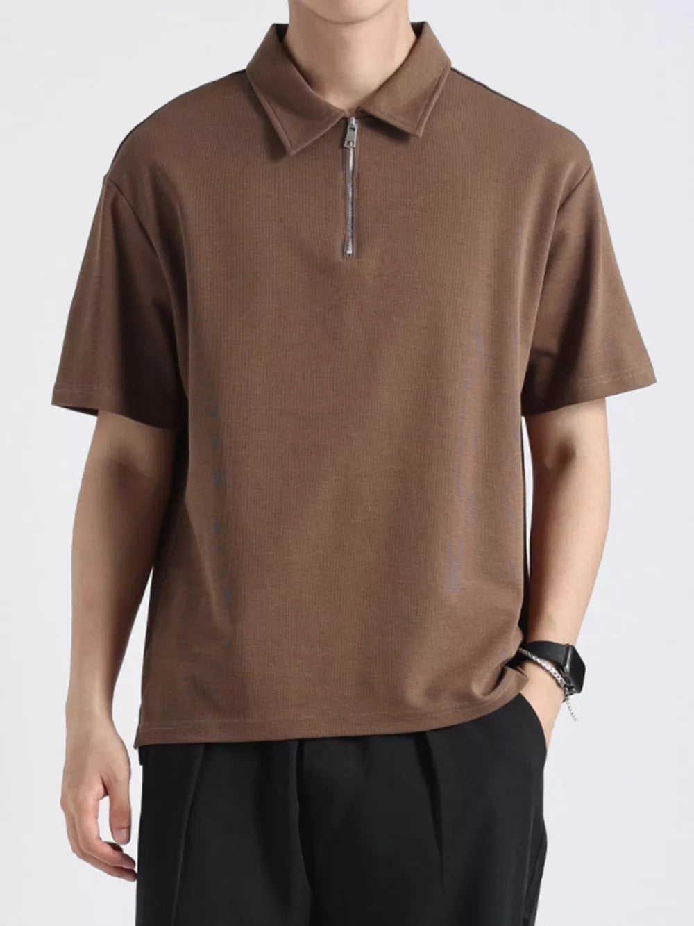 Brown cotton zippered polo shirt with short sleeves and a ribbed texture.