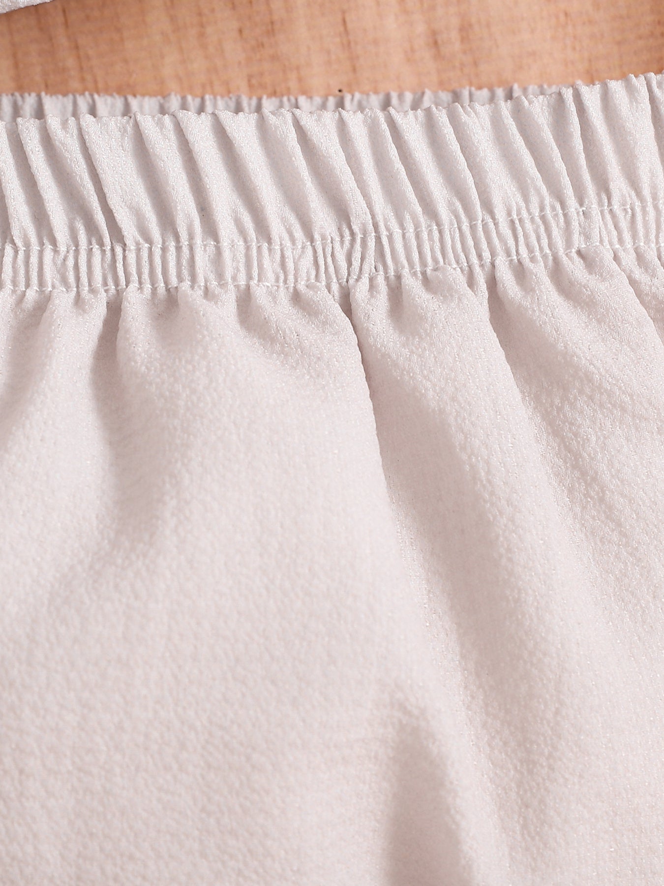 Baby cotton two-piece set with elastic waistband and bloomer bottoms.