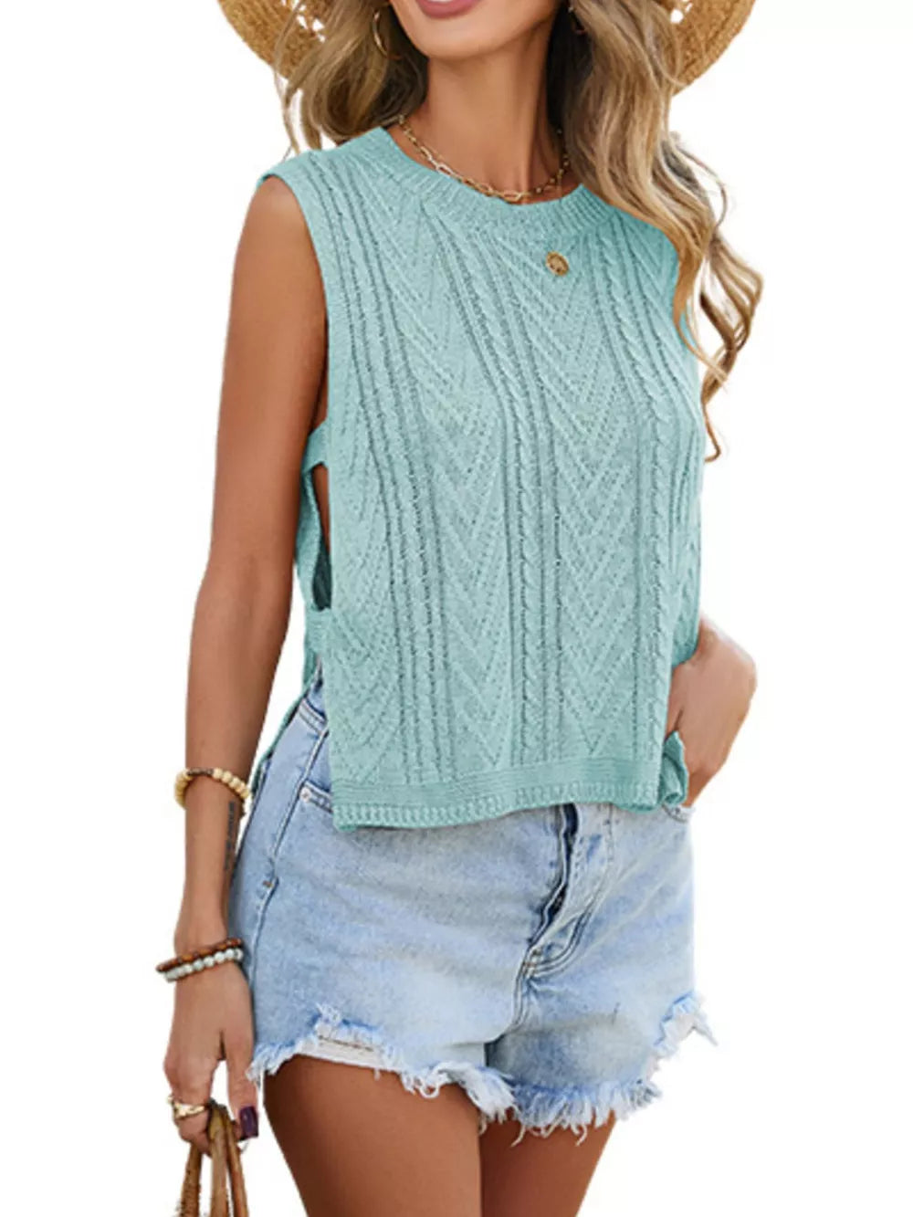 Teal chevron knit sleeveless sweater vest with side slits and crew neck.