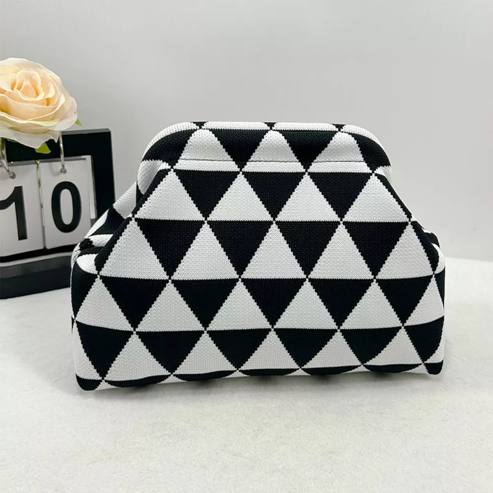 Vibrant knit clutch with striking black and white triangle pattern