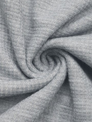 Gray waffle knit fabric detail of a button-down hooded pullover.