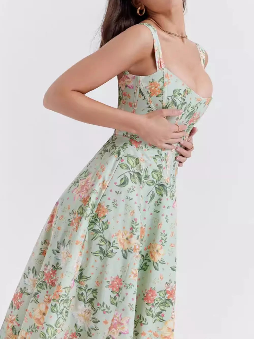 Floral midi dress in sage with sweetheart neckline and side slit, detailed view.
