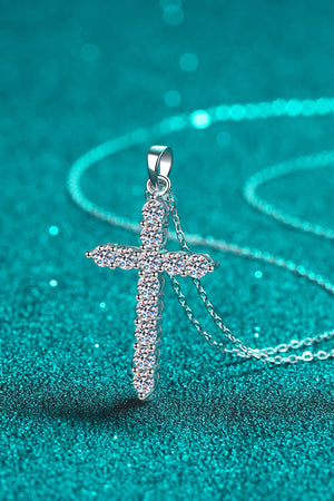 Silver pavé diamond cross pendant necklace with delicate chain.