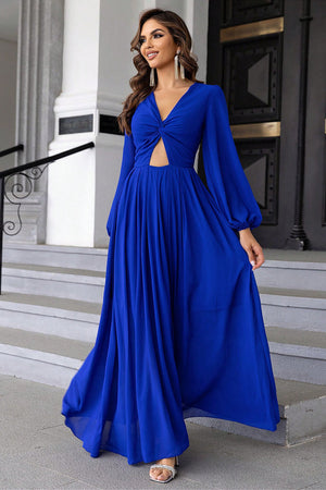 Royal blue maxi dress with twisted bodice cutout and long balloon sleeves.