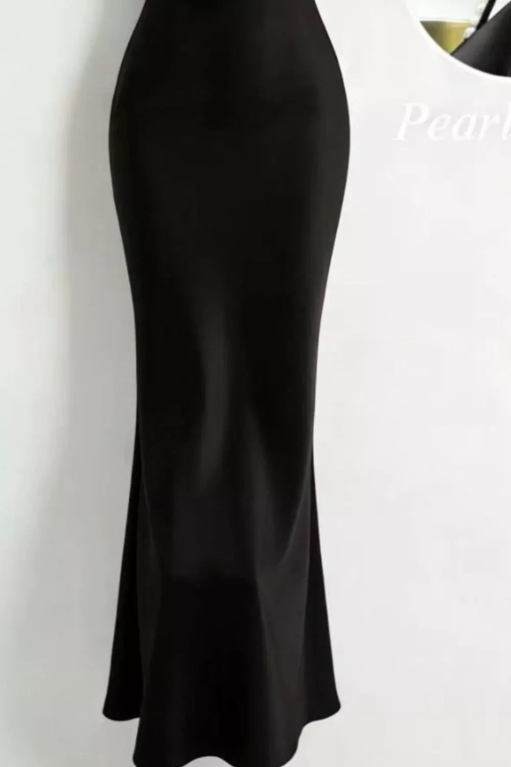 Black satin cowl neck maxi dress with pearl embellishments.