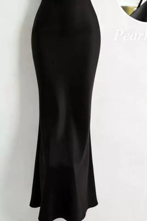 Black satin cowl neck maxi dress with pearl embellishments.