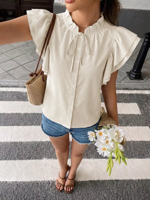 Beige button-down shirt with ruffle sleeves and tie-neck detail.