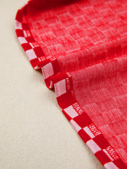Red and white checkered print shirt with ruffle sleeve detail.