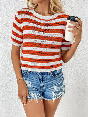 Open-knit striped crew neck top in orange and white with short sleeves.