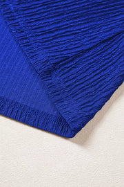 Blue textured polyester shirt with ruffle trim detail
