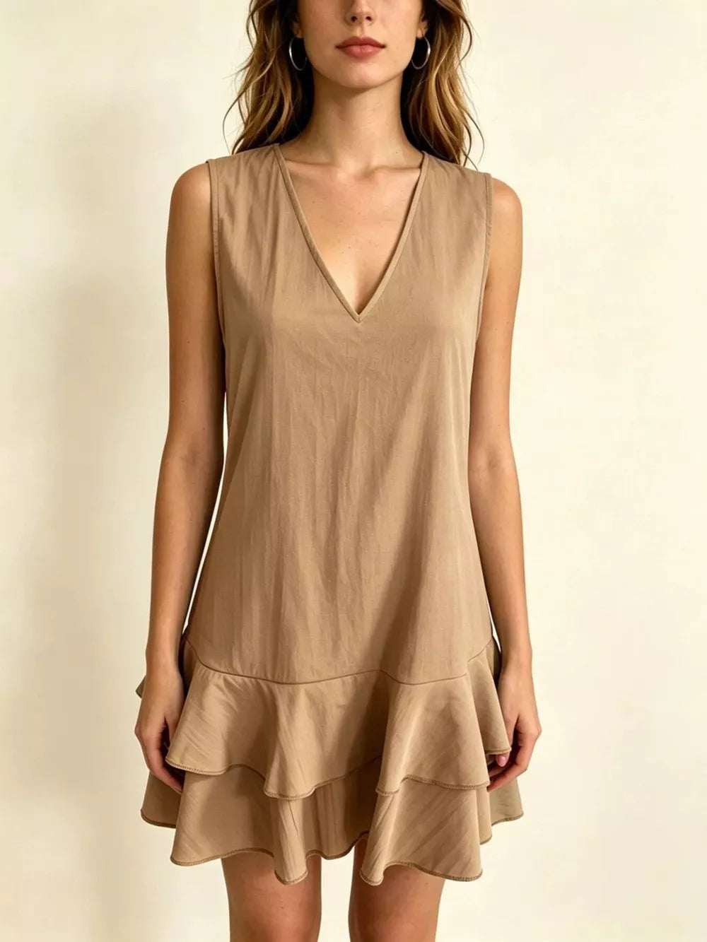 Khaki tiered ruffle mini dress with V-neck and sleeveless design.