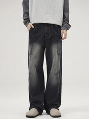 Relaxed fit washed wide-leg jeans in black with cargo pockets and a faded wash.