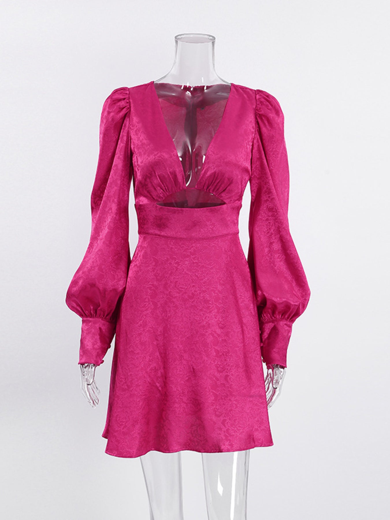 Vibrant cerise mini dress with deep V-neck, cutout detail, and lantern sleeves.