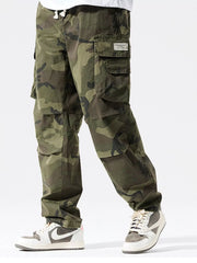 Casual cargo pants in camouflage pattern with drawstring waist and multiple pockets.