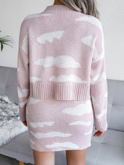 Dusty pink acrylic knit co-ord set with white cloud pattern, crew neck sweater and mini skirt.