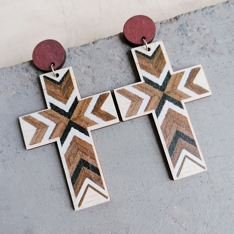 Geometric cross statement earrings with wood grain pattern and maroon studs