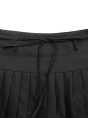 Black tie-waist pleated mini skirt with a drawstring detail.