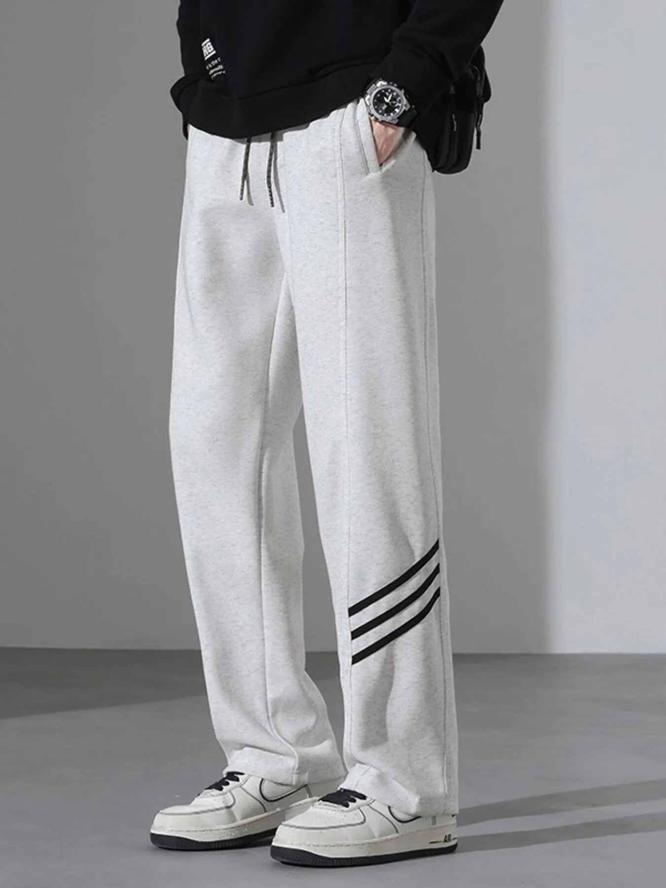 Light Flower Gray casual sweatpants with black side stripes and drawstring waist.