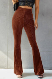 Brown ribbed velvet palazzo trousers with a flared leg
