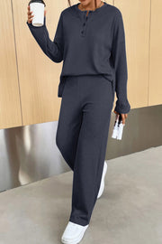 Relaxed ribbed henley set in dark blue with buttoned neckline and wide leg pants.