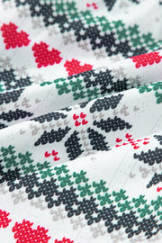 White cotton pajama set with festive red heart and Christmas tree pattern.