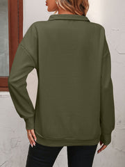 Army green quarter-zip relaxed fit sweatshirt with long sleeves and ribbed cuffs and hem.