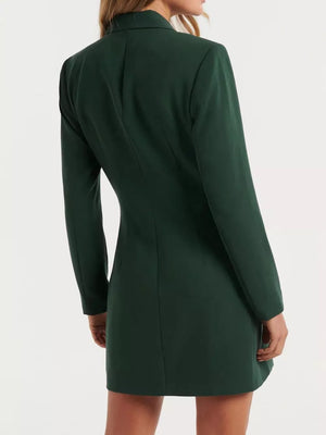 Dark green tailored double-breasted blazer dress with buttoned front and notched lapels.