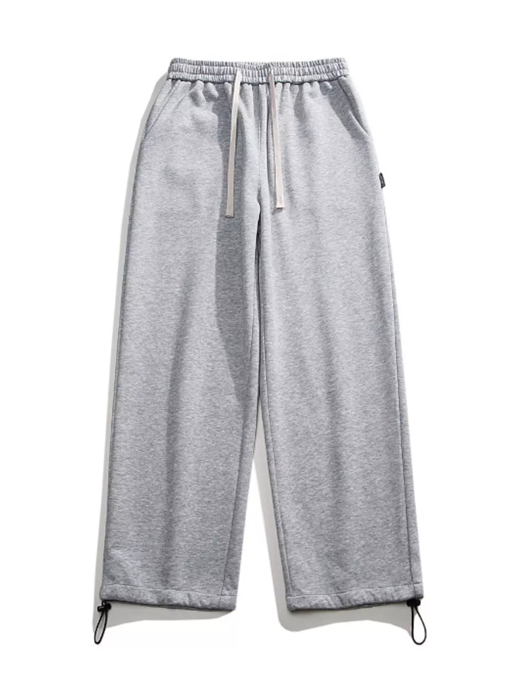 Light gray cotton sweatpants with drawstring waist and adjustable ankle cuffs.
