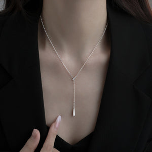 Silver Y-shaped pendant necklace with a single drop charm, 18k gold-plated.