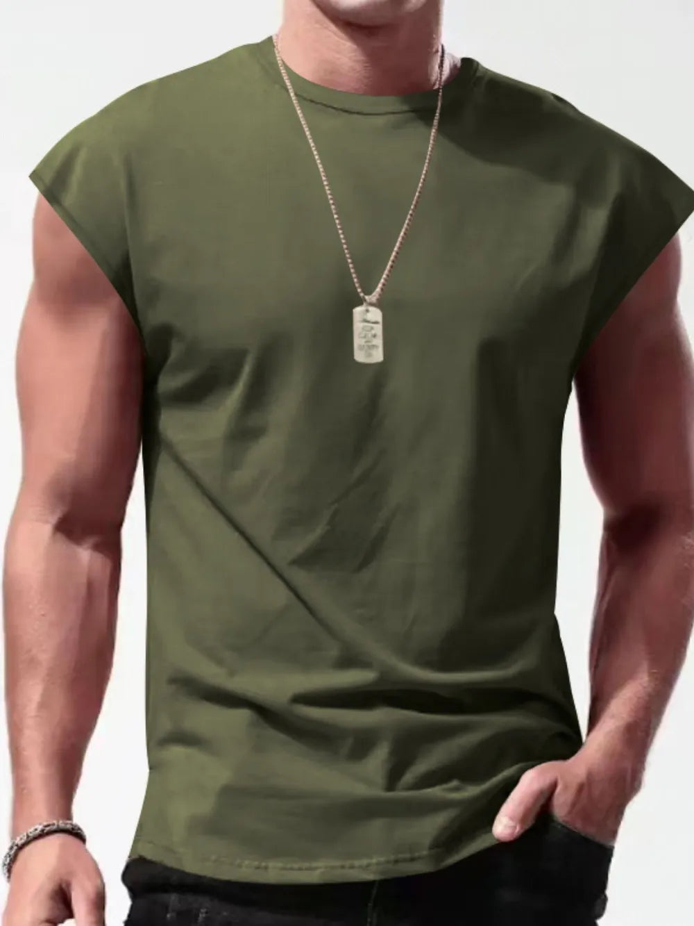 Muscle-fit sleeveless tee in army green with wide shoulders, crew neck, and a dog tag necklace.