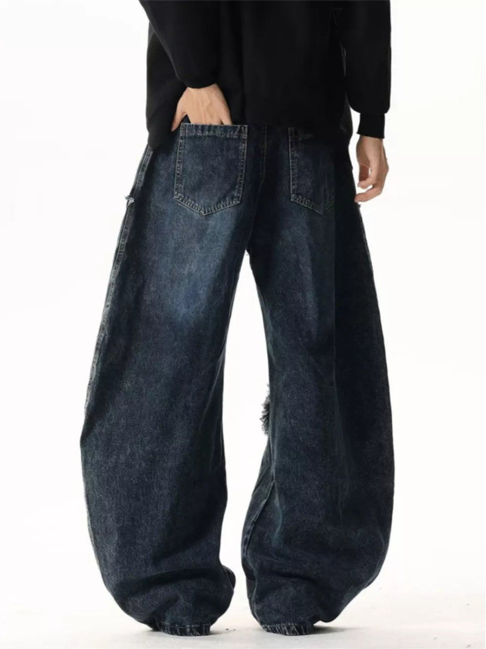 Dark wash cotton wide leg jeans with distressed details and star patchwork.