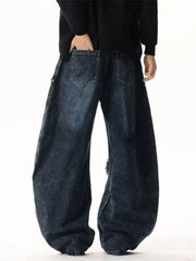 Dark wash cotton wide leg jeans with distressed details and star patchwork.