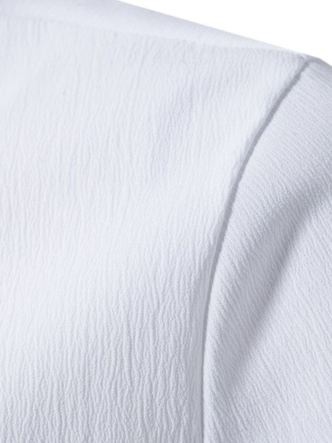 White cotton short sleeve shirt with textured fabric and band collar detail.