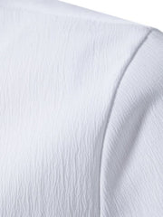 White cotton short sleeve shirt with textured fabric and band collar detail.