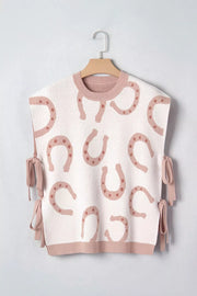 White knit tank top with pink horseshoe pattern and side ties.
